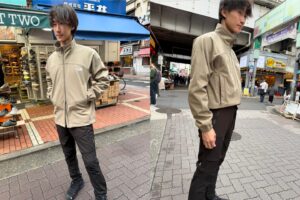 Staff wearing the Advanced Jacket. The adjustable hem drawcord improves fit and wind protection.