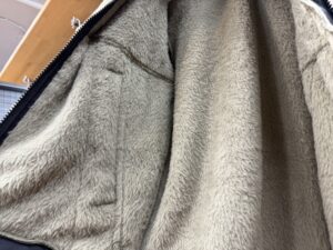 Close-up of the Versa Loft Jacket fleece fabric, showing its smooth texture and superior insulation.