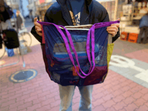 Cotopaxi Arenilla Mesh Tote long handles for shoulder carry